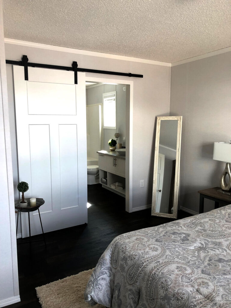 Arbour Cottage barn door between bedroom & bath